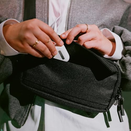 Incase Crosstown Sling - Compact, Durable and Lightweight, Crossbody & Hip Carry, Faux Fur Device Pocket, Easy Access Pockets - color: Black