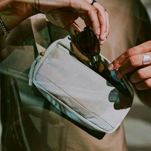 Incase Crosstown Sling - Compact, Durable and Lightweight, Crossbody & Hip Carry, Faux Fur Device Pocket, Easy Access Pockets - color: Limestone